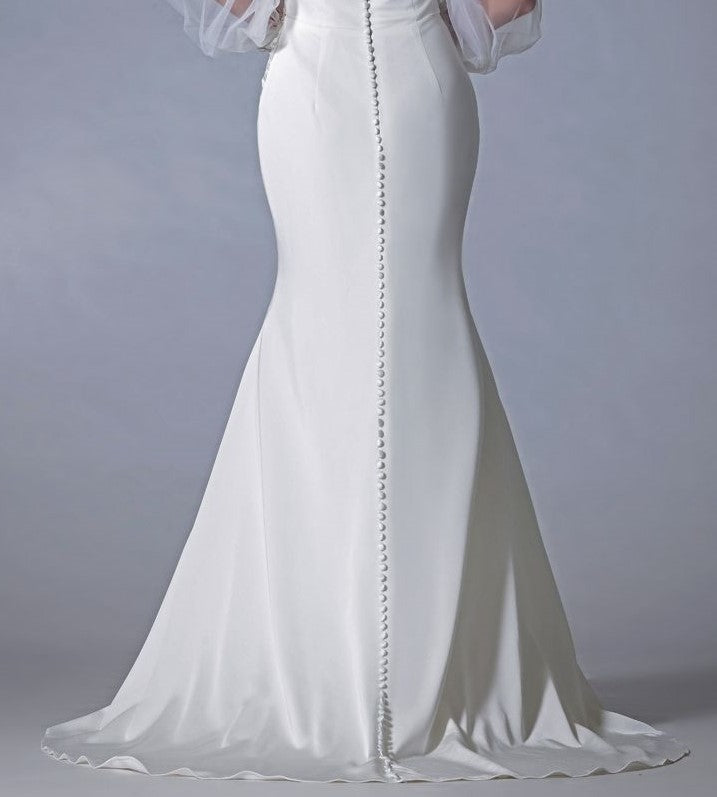 Add covered buttons to the back skirt